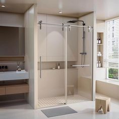 a bathroom with a walk in shower next to a sink