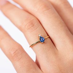 A 14K gold ring with a natural sapphire gemstone pear cut and a diamond brilliant cut in white gold or in yellow gold. A perfect engagement gold ring for women, stacking and delicate that adds glam to every outfit. Sapphire is the birthstone of September. 100% handcrafted with love! D E T A I L S ● Metal: 14K solid white gold, 14K gold, 14K rose gold ● Gemstones: Sapphire, Diamond ● Gemstones weight: Sapphire 0.4ct, Diamond 0.02ct ● Sapphire dimensions: 5.4 x 4.2 mm R I N G ∙ S I Z I N G For Gen Pear-shaped Sapphire Ring, Teardrop Sapphire Ring In Yellow Gold For Anniversary, Teardrop Yellow Gold Sapphire Ring For Anniversary, Yellow Gold Teardrop Sapphire Ring For Anniversary, Fine Jewelry Pear-shaped Sapphire Ring, Teardrop Sapphire Ring Fine Jewelry Gift, Fine Jewelry Teardrop Sapphire Ring Gift, Yellow Gold Pear-shaped Sapphire Ring, Anniversary Yellow Gold Teardrop Sapphire Ring