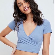 Wrap Top Short Sleeve V Neck Blue V-neck Crop Top For Vacation, Blue Cropped Summer Top, Casual Blue V-neck Crop Top, Light Blue V-neck Casual Crop Top, Casual Light Blue V-neck Crop Top, Light Blue Short Sleeve Crop Top For Day Out, Chic Blue Short Sleeve Crop Top, Chic Blue V-neck Crop Top, Light Blue Fitted V-neck Crop Top