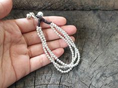 This bracelet made with 3 mm silver bead weaved together with dark brown wax cord and bell for closure with dangle. Length is approx. 7.5'' (B012) ♥..o00OoO,..Shipping..The item shipped by registered airmail within 3-5 working days after payment received. Usually takes 10-24 business days to reach destination.Feel free to contact me with any questions or requests.♥Thank you :)*~*~*~*~*~*~*~*~*~*~*~*~*~*~*~*~*~*~*~*~*~*~*~*~*~*~*~*~*~*~*~*~*~*~ Silver Braided Bracelet With Sliding Knot And Round Beads, Adjustable Silver Beaded Bracelet With Dangling Beads, Adjustable Silver Bracelets With Dangling Beads, Adjustable Silver Bracelet With Dangling Beads, Silver Adjustable Bracelet With Dangling Beads, Bracelet Simple, Silver Chains, Women Bracelet, Simple Bracelets