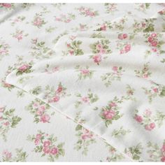 a white sheet with pink flowers on it