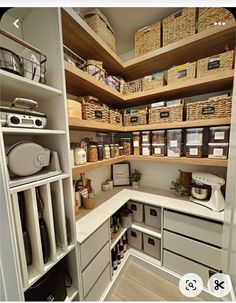 an organized pantry with lots of items in baskets and bins on the shelves next to each other