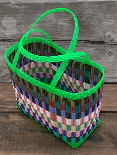 This a very traditional market basket used in Guatemala to do market purchases. It is woven plastic which makes it very resistant. This bag can hold easily 20 pounds and used on a daily basis, it can last 10-20 years without doubt, probably even a LIFETIME. It is a very resistant product. They are handmade carefully by a Guatemalan artisan. They are made to last. In Guatemala, it is possible to find a large selection of this baskets on very bright colours. Even exposed to the water, sun or dust, Green Rectangular Straw Bag For Market, Green Woven Square Straw Bag, Green Handwoven Square Straw Bag, Green Square Handwoven Straw Bag, Green Rectangular Woven Beach Bag, Green Basket Beach Bag, Everyday Green Basket Straw Bag, Green Woven Basket Straw Bag, Green Basket-shaped Straw Bag For Shopping