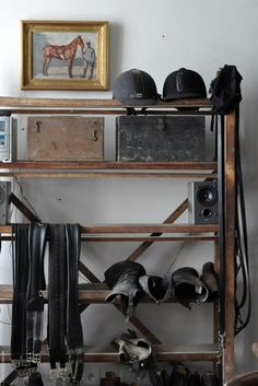 there is a shelf with many shoes and hats on it