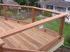 a wooden deck in front of a house