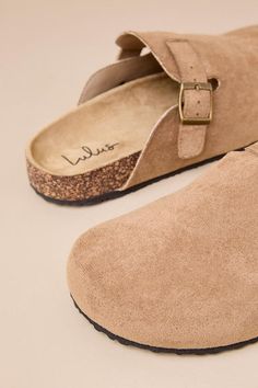 Your most convenient and casually cute looks are definitely going to include the Lulus Pereta Taupe Suede Flatform Slip-On Clogs! These soft faux suede clogs have a rounded-toe upper with a decorative strap detail and an adjustable bronze buckle. A contoured insole completes the simple, slide-on design. 0. 25" treaded foam sole. Contoured insole. Rubber sole has nonskid markings. Man made materials. Imported. Lulus | Pereta Taupe Suede Flatform Slip-On Clogs | Size 6. Suede Slippers With Buckle Closure And Round Toe, Casual Suede Clogs With Textured Footbed, Casual Suede Mules With Buckle Closure, Casual Open Toe Mules With Suede Lining, Casual Suede Clogs With Round Toe, Casual Flat Suede Slippers, Casual Beige Suede Slippers, Casual Clogs With Suede Lining And Round Toe, Casual Closed Toe Sandals With Suede Lining