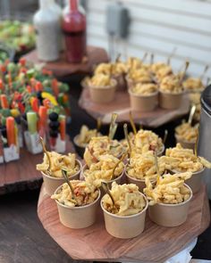 small cups filled with food sitting on top of a table