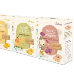 three boxes of natural baby food on a white background