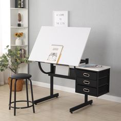 a black and white desk with a book on it