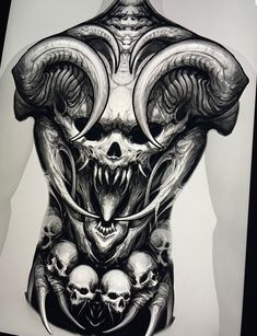 the back of a man's body with skulls and horns on it, in black and white