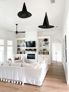 a living room filled with furniture and white walls