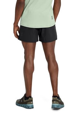 Lightweight, quick-drying fabric keeps you going for miles in running shorts with a supportive interior brief and handy pockets for keys, cash and energy gels. 5" inseam; 25" leg opening; 10 1/2" front rise; 14" back rise (size Medium) Elastic/drawstring waist Front slant pockets; side mesh pocket Interior brief 100% recycled polyester Machine wash, dry flat Imported Stretch Bottoms With Pockets For Running Errands, Functional Running Shorts With 5-inch Inseam, Nylon Athletic Shorts For Running, Nylon Athletic Running Shorts, Nylon Running Athletic Shorts, Running Bottoms With Built-in Shorts And 5-inch Inseam, Compression Go-dry Shorts For Running, Compression Running Shorts With Go-dry Technology, Compression Go-dry Running Shorts