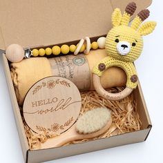 a box filled with toys and items for a baby's first birthday or christmas gift