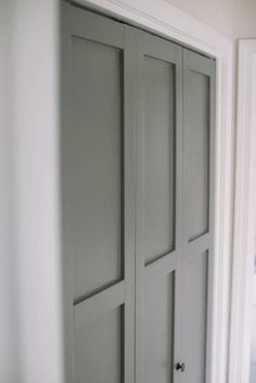 an open closet door in a white room