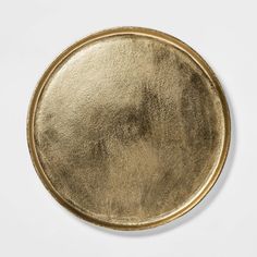 a gold plate is shown against a white background