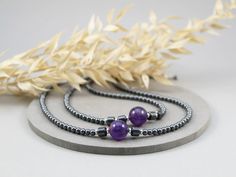 Statement Amethyst and Hematite Choker Necklace, 925 Sterling Silver.
Stunning 12mm purple Amethyst bead is beautifully finished off with 6mm barrel shaped and 4mm round Hematite beads and 925 Sterling Silver components, which gives the necklace very sparkly and unique look. The total length of the choker is around 17 inches (43cm) long, so it lays beautifully around your neck and it has an extra 1 inch (2.54cm) of dainty chain to adjust it perfectly just for you!
This gorgeous choker necklace is perfect for everyday and special occasions. It would make a gorgeous gift for her, Mother's Day gift, Christmas or Birthday Gift or maybe an unforgettable detail for your Boho chic wedding?
www.madamestore.etsy.com
#necklace #choker