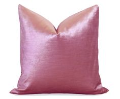 a pink pillow on a white background