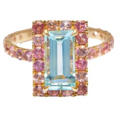 This youthful design showcases a gorgeous baguette aquamarine surrounded by an array of colorful pink tourmalines. . Our Aquamarine is as clear and blue as the cleans of the Maldives. A sprinkling of dazzling tourmalines in all shades of pinks make a wonderful contrasting halo. This whimsical and modern design shows just how playful fine jewelry can be. We absolutely adore it and hope you do too. All our gems are carefully made to perfection in our atelier in Bangkok, the colored gemstone capita Candy Ring, Spring Air, Pink Tourmaline Ring, Jewelry Accessories Ideas, Cheer You Up, Modern Ring, Tourmaline Ring, Dream Jewelry, Jewelry Inspo