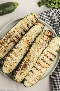 grilled zucchini on a plate with parmesan cheese