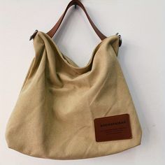 Simple Canvas Shoulder Bag, Large Capacity All-Match Satchel Bag, Trendy Crossbody Bag Creamy White Khaki Softback Everyday Bag, Solid Color Canvas Hobo Bag With Large Capacity, Large Capacity Khaki Canvas Shoulder Bag, Khaki Shoulder Bag With Large Capacity For Daily Use, Large Capacity Khaki Shoulder Bag For Daily Use, Large Capacity Solid Color Canvas Hobo Bag, Khaki Large Capacity Shoulder Bag For Daily Use, Khaki Canvas Softback Bags, Khaki Softback Canvas Bags