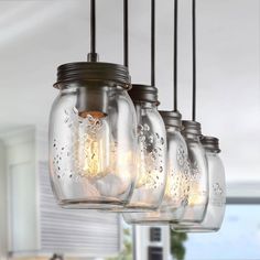 five mason jar chandelier hanging from the ceiling