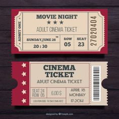 two red and white movie tickets on wooden background