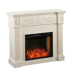 a white fireplace with an ornate design on the mantle