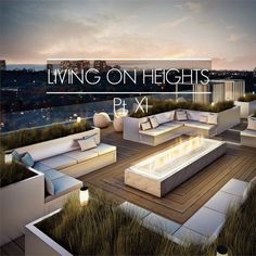 an outdoor living area with couches, tables and lights on the top of it