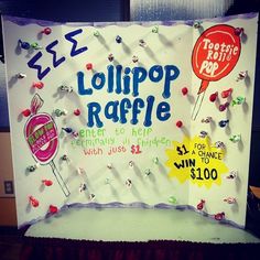 a sign with candy and lollipop on it that says lollipop raffe