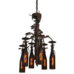 a chandelier with five bottles hanging from it's center and six lights on each side