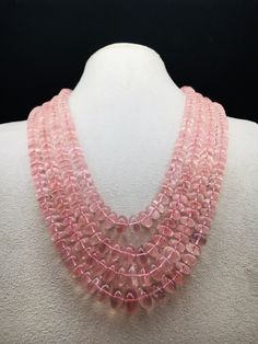 100% Natural Rose Quartz smooth rondelle shape beaded necklace with adjustable silk cord closure.  Details: - Gemstone - Rose Quartz Shape - Rondelle Gross weight - 1073.75 carat Net weight - 1033.00 carat Length - Inner - 15 inches, Outer - 19 inches Calibration of beads - 8.00 millimeters till 14.00 millimeters SKU - HJSPSAR0033 100% NATURAL ROSE QUARTZ AMAZING NECKLACE UNIQUE NECKLACE PINK COLOR NECKLACE Thank you for your kind visit to my shop. NOTE: - You will receive the same product you see in the picture.   Dear Buyers, please feel free to ask questions    We will be glad to answer & solve query regarding this product RETURN POLICY: -   Every piece of jewelry and inputs ( gemstones, diamonds, making, and setting) is tested by our team of experts and experienced  artisans to generat Luxury Pink Round Beads Jewelry, Pink Round Gemstone Beads Jewelry, Pink Round Gemstone Beaded Jewelry, Pink Round Jewelry With Gemstone Beads, Round Pink Jewelry With Gemstone Beads, Elegant Pink Crystal Necklaces With Faceted Beads, Elegant Pink Beaded Necklace With Gemstone Beads, Elegant Pink Gemstone Beaded Necklaces, Elegant Pink Rondelle Beaded Necklaces