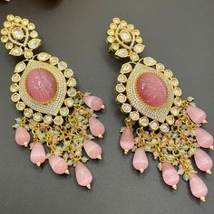 The Perfect pair of earrings for the wedding season in multiple statement colors! The pair comes in 5 different beautiful shades to complement any outfit and is made of semi precious stones and cz work with ombre beads as accents. Luxury Multicolor Temple Bridal Earrings, Yellow Gemstone Earrings For Wedding, Elegant Handmade Yellow Chandelier Earrings, Luxury Multicolor Fusion Jhumkas, Luxury Multicolor Bollywood Earrings, Formal Yellow Multi-stone Jewelry, Traditional Multicolor Jeweled Chandelier Earrings, Yellow Chandelier Earrings, Statement Earrings Wedding