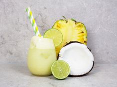 a pineapple and coconut drink with two straws