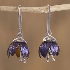 As cute as buttons two gleaming purple flowers are handcrafted from sterling silver plated in titanium. Mexican artisan Diana Solis designs this modern pair of dangle earrings which is further enhanced with sterling silver. Each earring dangles from a sterling hook. Nickel-free Purple Drop Flower Earrings, Purple Nickel-free Drop Flower Earrings, Purple Sterling Silver Flower Earrings For Gift, Purple Flower-shaped Sterling Silver Earrings, Purple Flower Sterling Silver Earrings, Gift Purple Flower Earrings In Sterling Silver, Earrings Button, Silver Wrap Ring, Sterling Silver Charm Bracelet