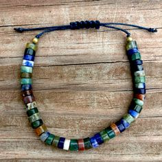 Tones Of Blue, Green, Brown And Grey On A Navy Cord. Adjustable Blue Earthy Jewelry, Bohemian Lapis Lazuli Beaded Bracelets, Adjustable Blue Beaded Earthy Bracelet, Handmade Earthy Multicolor Bracelets, Adjustable Earthy Blue Beaded Bracelets, Bohemian Lapis Lazuli Beaded Bracelets With Natural Stones, Adjustable Lapis Lazuli Beaded Bracelets Bohemian Style, Bohemian Beaded Bracelets With Lapis Lazuli Stones, Bohemian Beaded Bracelets With Lapis Lazuli