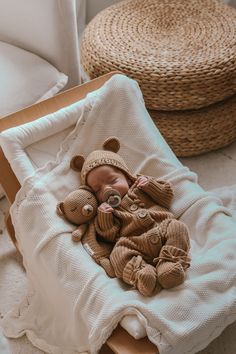 a baby is sleeping in a crib with teddy bears