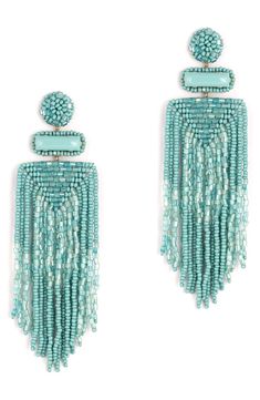 Designed to swish and sway right above the shoulders, these dramatic tassel earrings are handcrafted with shimmery beads and sparkly faux-stone accents. 3 3/4" drop; 1 1/4" width Post back Handmade Brass/glass/enamel/faux leather Imported Beaded Dangle Chandelier Earrings, Turquoise Earrings With Beaded Fringe, Turquoise Beaded Fringe Dangle Tassel Earrings, Turquoise Tassel Earrings With Beaded Fringe, Turquoise Beaded Fringe Chandelier Earrings, Dangle Tassel Chandelier Earrings, Elegant Turquoise Tassel Earrings With Fringe, Elegant Turquoise Tassel Fringe Earrings, Elegant Turquoise Tassel Earrings