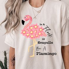 This adorable flamingo Tee comes in a variety of sizes from S-5XL. . No side seams mean there are no itchy interruptions under the arms. The shoulders have tape for improved durability. .: 100% cotton (fiber content may vary for different colors) .: Medium fabric .: Classic fit .: Tear-away label .: Runs true to size Casual Cotton T-shirt With Flamingo Print, Casual Crew Neck T-shirt With Flamingo Print, Pink Flamingo Print T-shirt For Summer, Pink Flamingo Print Short Sleeve T-shirt, Pink Short Sleeve T-shirt With Flamingo Print, Casual Pink Flamingo Print T-shirt, Casual Pink T-shirt With Flamingo Print, Casual Summer T-shirt With Flamingo Print, Casual Flamingo Print T-shirt For Summer