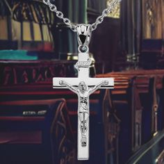 This unisex pendant charm is a stunning expression of faith, handcrafted from gleaming sterling silver with a beautiful banner inscribed above Jesus Christ on the holy cross. Choose from an 18" chain to complete this elegant accessory. Perfect for both men and women, this piece is sure to become a treasured addition to your jewelry collection. Classic Sterling Silver Cross Charm, White Gold Sterling Silver Crucifix, Silver Crucifix Necklace With Charms, Sterling Silver Crucifix Necklace With Polished Finish, Sterling Silver Crucifix Cross Necklace In White Gold, White Gold Sterling Silver Crucifix Necklace, Sterling Silver Engraved Cross Pendant, Silver Spiritual Crucifix Jewelry And Charms, Spiritual Silver Crucifix Jewelry And Charms