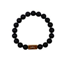 Make a lasting impression with the Alpha Phi Alpha Fraternity Custom Bead Bracelet! Crafted from high-quality Onyx stone and 18K gold plated stainless steel decorative balls, this elegant piece of jewelry is sure to get you noticed. Its tarnish-free and waterproof design makes it durable enough for everyday wear. Plus, it features a beautiful gold plated bar that is engraved with the iconic Alpha Phi Alpha Greek letters — adding the perfect finishing touch to your look. Choose between three uniq Minimalist 8mm Onyx Bead Jewelry, Elegant Hand-strung Rosary Bracelet For Healing, Classic Polished Pearl Bracelet Gift, Classic Polished Pearl Bracelet As Gift, Classic Polished Pearl Bracelet As A Gift, Elegant Personalized Stretch Bracelet With Round Beads, Gold Beaded Bracelets With Onyx Gemstones, Elegant Bracelets With 8mm Beads As A Gift, Gold Onyx Beaded Bracelets With Gemstones