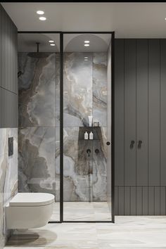 a modern bathroom with marble walls and flooring