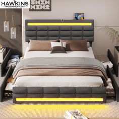 a modern bedroom with an upholstered bed and yellow lights on the headboard