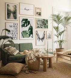 a living room filled with furniture and pictures on the wall