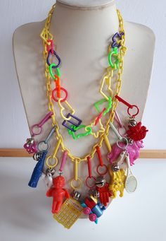 Gorgeous collector piece! VINTAGE 11 big figural charms multi-color plastic Bib NECKLACE with yellow plastic chain - with clasp. 17'' INCHES. biggest charm: 4 inches. shortest charm: 2.5 inches. Good vintage condition with signs of wear and tear consistent with the age of the piece - sold as is -return not accepted. IMPORTANT TO READ : To make this a smooth and pleasant transaction experience for everyone, all buyers need to read and understand the description, the terms of sale, the payment and 80 Jewelry, Plastic Bibs, 1980s Fashion Trends, Plastic Gift Wrap, Remembrance Jewelry, Recycled Jewelry, Charm Necklaces, Dream Style, Bib Necklace