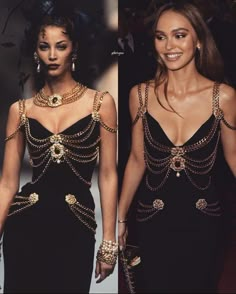 two women in black dresses with gold chains on them