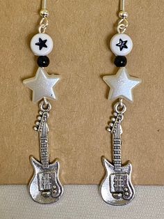 🤍a pair of y2k rockstar earrings 🧷handmade with love and packaged with care 🪩earring backs and 5 freebie stickers are included 🎼thanks so much for visiting my shop! Rockstar Girlfriend Jewelry, Rockstar Earrings, Rockstar Jewelry, Rockstar Y2k, Y2k Rockstar, Rockstar Girl, Girl Rockstar, Random Jewelry, Freebie Stickers