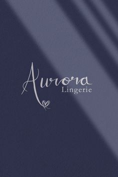 the logo for aurora lingere is shown on a dark blue background with long shadows