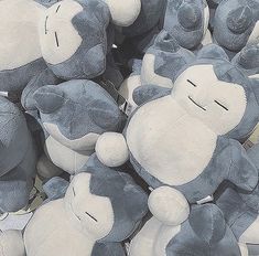 a pile of blue and white stuffed animals