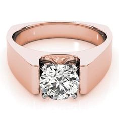 a rose gold engagement ring with a round diamond in the center, on a white background