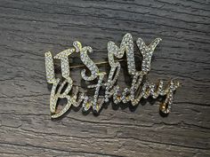 "It's my Birthday" Rhinestone pin Color: Available in Silver or gold plated (Select style at checkout) Size: 3.5" Wide & 1.5" Tall New Comes with velvet pouch Celebrate your special day in style with this stunning It's My Birthday rhinestone brooch pin! This dazzling piece of jewelry is the perfect accessory to add some sparkle and shine to your birthday outfit. Whether you're treating yourself or searching for a thoughtful gift for a birthday queen, this brooch is sure to make a statement. Shin Gold Jewelry With Rhinestones For Birthday, Gold Bling Brooches Gift, Gold Bling Brooches For Gift, Gold Rhinestone Party Pins, Gold Brooches For Valentine's Day Party, Gold Rhinestone Pins For Party, Gold Party Brooches With Bling, Birthday Queen, It's My Birthday